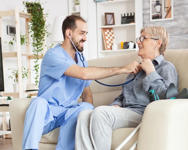young_doctor_using_stethoscope_listen_old_woman_heart_beat_nursing